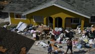 Residents work to salvage belongings near their homes in the wake of Hurricane Dorian in Marsh Harbour, Great Abaco, Bahamas, September 7, 2019. REUTERS/Loren Elliott