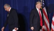 (FILES) In this file photo taken on April 27, 2016 Republican presidential candidate Donald Trump (R) takes the stage after being introduced by former U.S. Ambassador to Iraq and Afghanistan Zalmay Khalilzad at the Mayflower Hotel in Washington, DC. AFP /