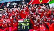 Ferrari's Charles Leclerc celebrates winning the race with team mates. Reuters/Massimo Pinca 