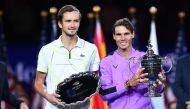Rafael Nadal of Spain (R) holds the trophy after his win over Daniil Medvedev of Russia (L) during the men's Singles Finals match at the 2019 US Open at the USTA Billie Jean King National Tennis Center in New York on September 8, 2019. AFP / Johannes EISE
