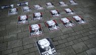 File photo of placards depicting Julian Assange are seen outside of Westminster Magistrates Court in London, where a case hearing for U.S. extradition of Wikileaks founder Julian Assange was held on June 14, 2019. REUTERS/Hannah Mckay/File Photo