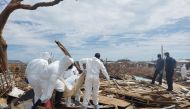 Members of the Bahamian Defense Force remove bodies from the destroyed Abaco shantytown called Pigeon Peas, after Hurricane Dorian in Marsh Harbour, Bahamas September 8, 2019. REUTERS/Zach Fagenson
