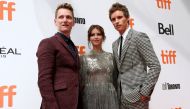 Director Tom Harper, Eddie Redmayne and Felicity Jones arrive at the Canadian premiere of