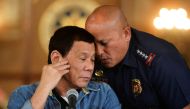 File photo: Philippine National Police chief General Ronald Dela Rosa whispers to President Rodrigo Duterte during the announcement of the disbandment of police operations against illegal drugs at the Malacanang palace in Manila, Philippines January 29, 2
