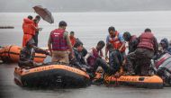 National Disaster Response Force (NDRF) and State Disaster Emergency Response Force (SDERF) personnel conduct rescue and search operations for survivors at Lower Lake in Bhopal on September 13, 2019, after boats overturn as they carry people and an idol o