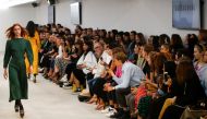 Members of the public watch models present creations at the Alexa Chung public catwalk show during London Fashion Week in London, Britain, September 14, 2019. REUTERS/ Henry Nicholls