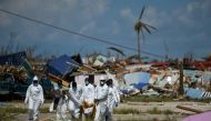 FILE PHOTO: Personnel from the Royal Bahamas Police Force remove a body recovered in a destroyed neighborhood in the wake of Hurricane Dorian in Marsh Harbour, Great Abaco, Bahamas, September 9, 2019. REUTERS/Loren Elliott