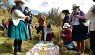 Ecuadorean indigenous people share a traditional lunch in Quimsacocha, Azuay province, Ecuador, on September 2, 2019. AFP / Rodrigo Buendia
 