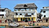 Boats bob in the water at Lamu island, a UNESCO World Heritage site and tourist island known for being one of the world's oldest Swahili settlements. Kenya, July 26, 2019. Thomson Reuters Foundation/Kim Harrisberg