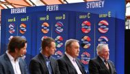 A screen showing the ATP Cup draw results (background) are seen as Australia's former tennis players (L-R), Pat Rafter, Lleyton Hewitt, John Newcombe and Ken Rosewall attend the event in Sydney on September 16, 2019. AFP / Saeed Khan 