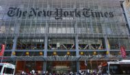 In this file photo taken on February 26, 2017, people take part in a protest outside the New York Times in New York. AFP / Kena Betancur