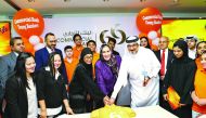 Commercial Bank officials celebrate with the graduates of the ‘Young Bankers Summer Internship Programme 2019’ in Doha recently. 