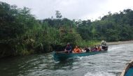 An indigenous family leaves Yorkin by boat, in Costa Rica's southern Caribbean region, on August 22, 2019. Thomson Reuters Foundation/Sebastian Rodriguez