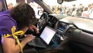 An attendee of the 2019 DEF CON cybersecurity event is seen at the conference's car hacking village in Las Vegas, Nevada, US, August 9, 2019. Reuters/Tina Bellon