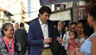 Justin Trudeau greeting mothers at a clinic run by the non-governmental organisation Likhaan during a visit on the sidelines of the ASEAN summit