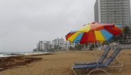 Beach chairs are seen at a beach as hurricane Irma approaches Puerto Rico in San Juan on September 5, 2017. AFP/Ricardo Arduengo