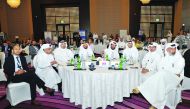 Rashid bin Ali Al Mansoori (fourth right), CEO, Qatar Stock Exchange (QSE);  Mohsin Mujtaba (left), Director of Products and Market Development at QSE and other officials during the opening session of 10th Annual IR Conference, held yesterday. Pic: Salim 