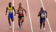 Christian Coleman of the US in action with Japan's Abdul Hakim Sani Brown and Barbados' Mario Burke Reuters/Ahmed Jadallah