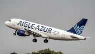 FILE PHOTO: An Airbus A319 aircraft belonging to the Weaving group's French airline Aigle Azur taking off from Lille Airport in Lesquin, northern France.  AFP / PHILIPPE HUGUEN