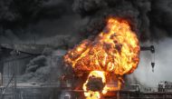 Fire from a vessel is seen at a port in Ulsan, South Korea, September 28, 2019. Yonhap via REUTERS