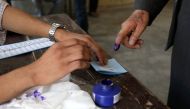 An election official assists an Afghan man at a polling station in Kabul, Afghanistan September 28, 2019. REUTERS/Omar Sobhani