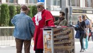 A street vendor tries to sell tickets for the Mozart and Strauss concerts in front of the Vienna State Opera on September 27, 2019. AFP / ALEX HALADA
