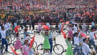 People take part in the National Day parade at Tiananmen Square in Beijing on October 1, 2019, to mark the 70th anniversary of the founding of the People’s Republic of China. / AFP / GREG BAKER