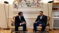 French President Emmanuel Macron speaks with Ukrainian film director Oleg Sentsov at the Permanent Representation of France to the Council of Europe in Strasbourg, France, on October 1, 2019. Frederick Florin/Pool via REUTERS