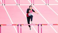Qatar’s Mariam Farid in action during the women’s 400 metres hurdles heats yesterday. Picture: Abdul basit / The Peninsula