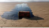 Handout picture by the Sergipe State Environment Administration (Ademas) on September 27, 2019, showing a barrel of oil spilled on a beach in Barra dos Coqueiros municipality, Sergipe state, Brazil. AFP / ADEMA