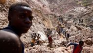 Labourers work at an open shaft of the SMB coltan mine near the town of Rubaya in the Eastern Democratic Republic of Congo, August 13, 2019. Reuters/Baz Ratner
 