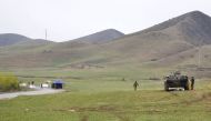 Kyrgyz and Uzbek troops are seen in a disputed area near the town of Kerben, Kyrgyzstan, March 25, 2016. Reuters / Hulkar Isamova