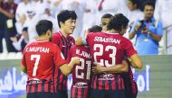Al Rayyan players celebrate after scoring a goal against Al Sadd during their QNB Qatar Stars League match played at the Jassim Bin Hamad Stadium, yesterday.