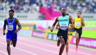 Bahamas’ Steven Gardiner (centre) crossing the finish line in the Men’s 400m final to win the gold medal on Friday.