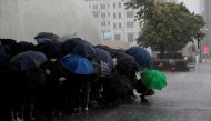 Anti-government protesters shelter from the rain under their umbrellas at the start of a demonstration in Tsim Sha Tsui district, in Hong Kong, China October 6, 2019. REUTERS/Susana Vera
 