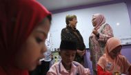 UN High Commissioner for Human Rights Michelle Bachelet talks to a teacher during a visit at the Rohingya Integrated School of Excellence in Kajang, Malaysia. October 4, 2019. Reuters/Lim Huey Teng