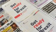 (FILES) In this file photo taken on September 02, 2019 an arrangement of newspapers photographed as an illustration in London on September 2, 2019, shows a full-page advertisement taken out by the UK Government in several daily newspapers as part of its p