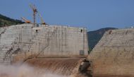 FILE PHOTO: Water flows through Ethiopia's Grand Renaissance Dam as it undergoes construction work on the river Nile in Guba Woreda, Benishangul Gumuz Region, Ethiopia September 26, 2019. Picture taken September 26, 2019. REUTERS/Tiksa Negeri - RC18957504