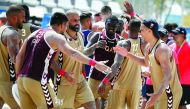 Qatari beach handball players celebrate after winning their opening match against Croatia during the ANOC World Beach Games at Al Gharafa, yesterday.