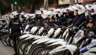 Motorcyclist policemen are deployed in a street in Quito on October 12, 2019, as a curfew took effect during the 10th day of a protest over a fuel price hike ordered by the government to secure an IMF loan.  AFP / Martin Bernetti 