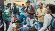 Rwanda's Ministry of Emergency Management (MINEMA) teken on October 10, 2019, shows the arrival of 123 Africal refugees and asylum seekers, mostly Eritreans, from Libya supported by Rwanda's UNHCR, the UN refugee agency, at the Kigali international airpor
