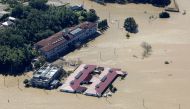 This aerial view shows the flooded Kawagoe Kings Garden nursing home beside the Oppegawa river in Kawagoe, Saitama prefecture on October 13, 2019.  AFP / JIJI PRESS
