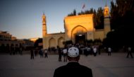A Muslim man arriving at the Id Kah Mosque for the morning prayer on Eid al-Fitr in the old town of Kashgar in Xinjiang Uighur Autonomous Region, China, on June 26, 2017. AFP / Johannes Eisele