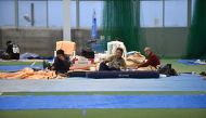 Elderly people rest at an evacuation shelter in Nagano on October 14, 2019, after Typhoon Hagibis crashed into Japan on October 12, unleashing high winds and torrential rain across 36 of the country's 47 prefectures, and triggering landslides and catastro