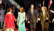 Britain's Prince William, Duke of Cambridge (Center R) and his wife Britain's Catherine, Duchess of Cambridge (Center L) are welcomed by Pakistan's Foreign Minister Shah Mehmood Qureshi (R) upon their arrival at the Pakistan's Nur Khan military airbase in