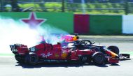 Red Bull’s Dutch driver Max Verstappen (behind) collides with Ferrari’s Monegasque driver Charles Leclerc (front) after the start of the Japanese Grand Prix in Suzuka on Sunday.
