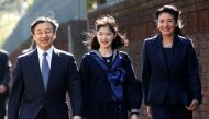 FILE PHOTO: Japan's Princess Aiko (C), accompanied by her parents Crown Prince Naruhito and Crown Princess Masako, arrives at her graduation ceremony at the Gakushuin Girls' Junior High School in Tokyo, Japan, March 22, 2017. REUTERS/Issei Kato/File Photo