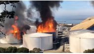 Smoke billows from fire burning in two tanks at a NuStar oil storage facility in Contra Costa County, California, U.S. October 15, 2019, in this still image obtained from a social media video. Courtesy of Napa County Sheriff's Office/Social Media via REUT
