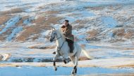 This undated picture released by Korean Central News Agency on October 16, 2019 shows North Korean leader kim Jong Un riding a white horse amongst the first snow at Mouth Paektu. - South Korea / AFP