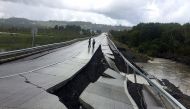 A damaged road is seen after a quake at Tarahuin on Chiloe island, southern Chile, December 25, 2016. Reuters/Alvaro Vidal 